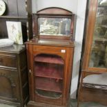 A Victorian mahogany inlaid music cabinet.