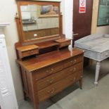 A mahogany inlaid dressing table.