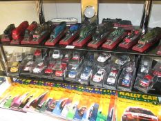 27 rally car magazines and diecast models and 14 locomotive models