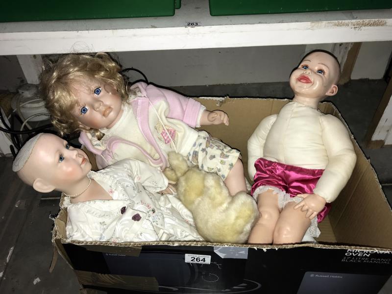 A quantity of porcelain dolls etc.