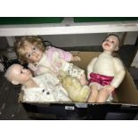 A quantity of porcelain dolls etc.