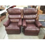 A pair of leather recliner chairs