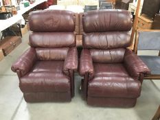 A pair of leather recliner chairs