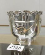 A small silver plant pot, hall marked for London, approximately 218 grams.(has small dints).