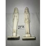 Grand Tour Carved Bone Figures: A pair of Egyptian style carved bone figures standing on