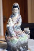 A fine 19th century famille rose figure of a lady (Guanyin) with child (child's foot A/F,