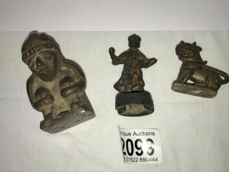 Bronze Artefact Group: A group of three bronzes - a bronze Chinese Lion - a bronze Indian figure -