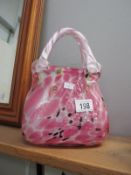 A large Murano style art glass handbag vase