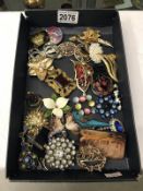 Approximately 33 vintage brooches