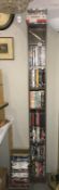 A quantity of DVDs including many boxed TV series and a tall slimline DVD / CD storage unit