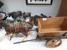 A quantity of pottery shire horses and carts
