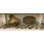 A Victorian brass chestnut roaster, Indian brass trays,