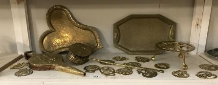 A Victorian brass chestnut roaster, Indian brass trays,