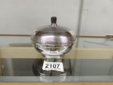 An engine turned silver lidded bowl with bakelite lining, hall marked for Birmingham 1846/47.