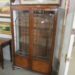 A mahogany display cabinet.