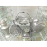 A pewter basket, inkwell, biscuit barrel, cruet, sugar sifter and hand mirror.