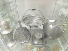 A pewter basket, inkwell, biscuit barrel, cruet, sugar sifter and hand mirror.