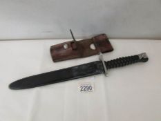 A Swiss 1957 pattern bayonet by Wenger with scabbard and belt frog.