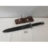 A Swiss 1957 pattern bayonet by Wenger with scabbard and belt frog.
