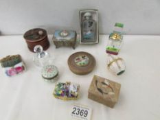 A mixed lot of trinket boxes and scent bottles.