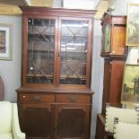 A mahogany glazed top book case.