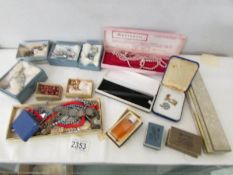 A mixed lot of vintage costume jewellery and vintage jewellery boxes.