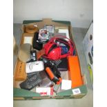 A box of misc. items including calculators, cameras, bibles etc.