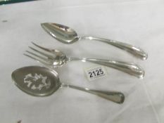 A pair of Dutch silver salad servers and a Dutch silver spoon, approximately 236 grams.