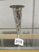 A decorative silver spill vase with weighted base, hall marked for London 1871/72, makers mark W C.
