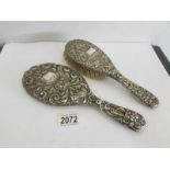 A silver hand mirror hall marked Walker & Hall,