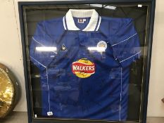 A Leicester City football club shirt signed and framed and glazed.