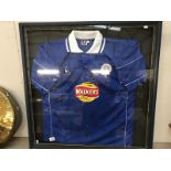 A Leicester City football club shirt signed and framed and glazed.