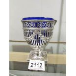 A decorative silver sugar bowl with original blue glass liner, hall marked for London 1827/28,