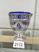 A decorative silver sugar bowl with original blue glass liner, hall marked for London 1827/28,