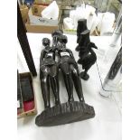 4 carved African figures.