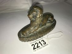 An old bronze lion paperweight