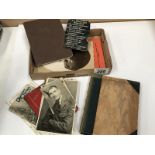 A small box containing military photos, etc.