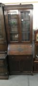 A 1930's oak bureau bookcase with leaded glass panels ****Condition report**** Top