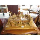 A carved olive wood figural group "The Last Supper" and an alter cross.