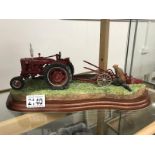 A Border Fine arts model of a tractor & plough