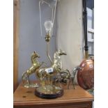 A solid brass rearing horse table lamp