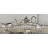A 3 piece silver tea set comprising teapot, sugar bowl and milk jug,