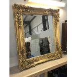 A gilt framed bevel edged mirror