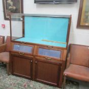 An old mahogany shop display cabinet.