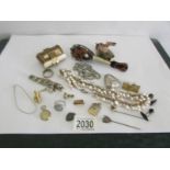 A mixed lot including costume jewellery, silver ring, miniature mandolin,