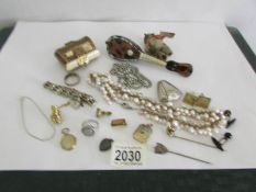 A mixed lot including costume jewellery, silver ring, miniature mandolin,