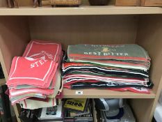 A large quantity of pub bar top towels/mats