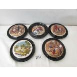 5 framed pot lids.