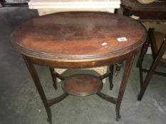 An Edwardian oval mahogany side/tea table