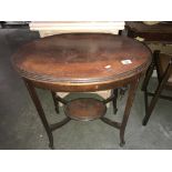 An Edwardian oval mahogany side/tea table